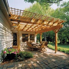 an outdoor patio with wooden pergols and chairs