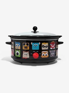 a black crock pot with cartoon characters on the front and sides, sitting against a white background