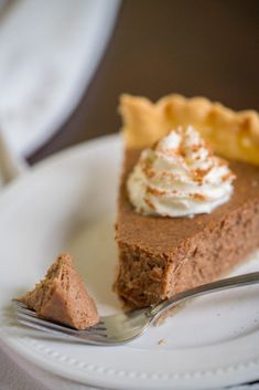 a piece of pie on a plate with a fork