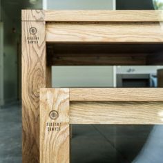 a close up view of a wooden table with the top section cut out to show the wood grain