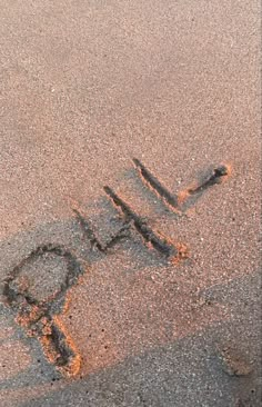 the word hope written in sand on a beach