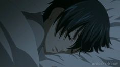 an anime character sleeping in bed with his eyes closed