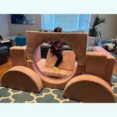 a person sitting on a fake chair in a living room