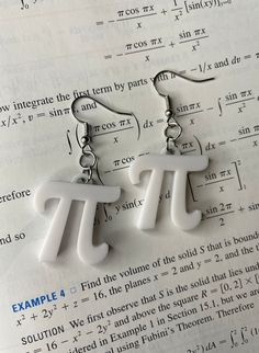 These are the perfect math/STEM earrings for those that want to show off their nerdy side. These Pi 3D-Printed earrings are great to wear on Pi day (March 14th) or can serve as a good luck charm on your upcoming math test. Perfect for you, or as a gift for a friend, family member, classmate, or teacher. These adorable lightweight earrings are created using an environmentally friendly plastic called PLA filament. It is a type of polyester made from fermented plant starch derived from corn starch, cassava, maize, sugarcane, or sugar beet pulp. PLA is durable, biodegradable, and recyclable.  Please note: Each 3D printed item is unique. Due to the nature of the 3D printing process, some items may have small imperfections or differences, due to the process of printing layer upon layer. This is 3d Print Earrings, 3d Printed Earrings, Printed Earrings, Math Stem, Sugar Beet, Math Test, Pi Day, Luck Charm, Friendly Plastic