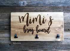 a wooden sign that says, mimi's bros board