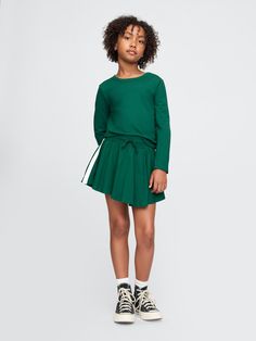 Soft cotton-blend shirt and skort set.  Crewneck.  Long sleeves.  Elasticized waist with drawcords.  Flutter skirt.  Inner shorts.  Straight, easy fit.  Hits at the hip.  Easy pull-on waist.  Easy through the hip and thigh. Rompers For Girls, Skort Set, Skort Outfit, Gap Kids, Girls Rompers, Outfit Set, Girl Fashion, Gap