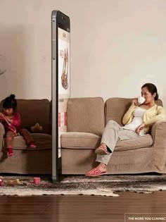 two women sitting on couches in front of a cell phone screen with an advertisement for shoes