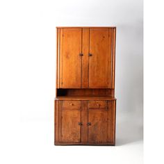 an old wooden cabinet with two doors