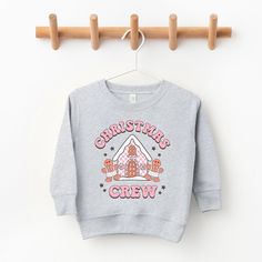 Looking for a cute sweatshirt for your kids? We have the perfect Christmas Gingerbread Crew graphic sweatshirt addition to their closet! Cute Christmas Sweatshirt With Graphic Print, Cute Christmas Graphic Print Sweatshirt, Toddler Christmas Shirt, Boys Christmas Shirt, Baby Boy Christmas Outfit, Boys Christmas Outfits, Baby Boy Christmas, Christmas Shirts For Kids, Toddler Sweater