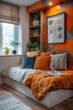 an orange and gray bedroom with pillows on the bed, plants in the window sill