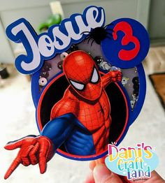 a hand holding up a sticker with the name jesus 3 on it