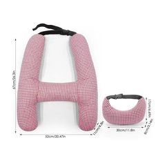 a pink and white checkered seat cushion next to a black headband on a white background