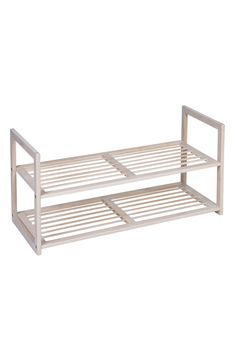 a white metal bed frame on a white background