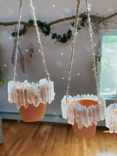 three hanging planters made out of plastic bags