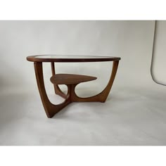 a wooden table sitting on top of a white floor