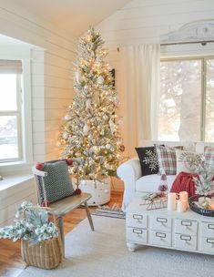 a living room with a christmas tree in the corner