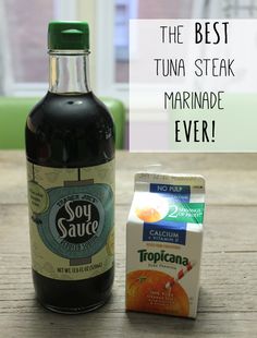 the best tuna steak marinade ever is on the table next to an orange juice