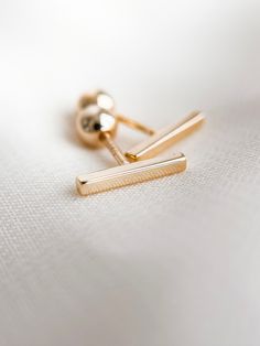 ✿ Tiny Modern Bar Gold Stud Earrings ✿ Made of 18k gold filled metal with screw on backs making them incredibly comfortable to wear.  Hypoallergenic, lead free, nickel free. Great for people with sensitive ears! Handmade in my home studio in Brookings, SD. Gold Bar Earrings Studs, Gold Bar Earrings, Bar Studs, Gold Stud Earrings, Modern Bar, Gold Filled Earrings, Bar Earrings, Gold Stud, Screw Back Earrings