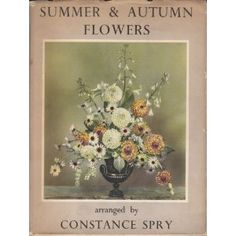 an old book with flowers in it and the title summer & autumn flowers arranged by constante spry