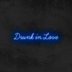 a neon sign that reads drunk in love