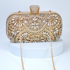 New to our Millennium collection, This beautiful romantic Silver Gold Crystal Floral Leaves bridal clutch bag is made of very fine quality of crystal,  rhinestones, fabric and metal and it comes with Chain 46 inches long os cross body bag Detachable chain for your Big day! The Clutch measure about 7.5 inches long, 4 inches wide and thickness of the bag is 1.8 inches  ► ABOUT YOUR ORDER * All items are neatly packaged in our beautiful jewelry boxes and elegant organza bags. * All items are 100% gift-ready. * Each order comes with a personalized handwritten card and a branded Millennium Bride jewelry cloth. * Each order comes with a free gift. ► PERSONALIZTION * If your order is a gift, you may contact us with the recipient's name or a message, and we'll print a personalized card that will b Gold Clutch Evening Bag For Wedding Guest, Luxury Gold Clutch For Wedding Guest, Elegant Gold Handheld Bag, Gold Clutch Bag For Evening, Elegant Gold Clutch For Wedding, Elegant Gold Rectangular Clutch, Gold Rectangular Elegant Clutch, Gold Clutch Bag For Wedding Guest, Glamorous Gold Clutch Evening Bag