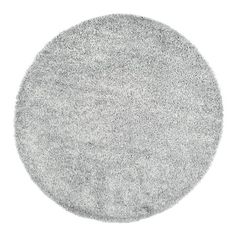 a round gray rug on a white background