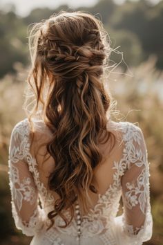 Elegant bridal hairstyle with intricate braiding and flowing curls, complemented by a delicate lace dress. Romantic Boho Wedding Hair, Flowy Wedding Hairstyles, Bridemaids Hairstyles Boho, Boho Style Wedding Hair, Boho Long Wedding Hair, Braided Hairstyles For Long Hair Wedding, Lord Of The Rings Wedding Hair, Boho Braids Wedding, Plus Size Wedding Hair