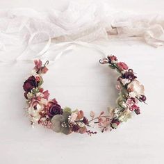 a flower crown is shown on a white surface