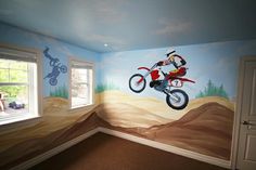 a child's room painted with dirt bike mural