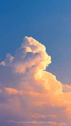 an airplane is flying in the sky at sunset or dawn, with clouds above it