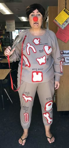 a woman dressed up as a clown holding a knife