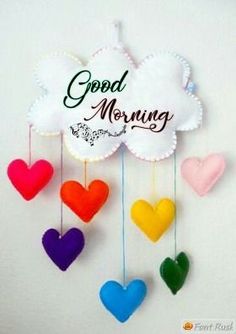 colorful hearts hanging from strings with the words good morning written on it's side