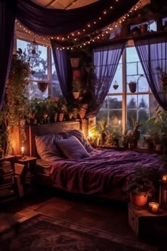 a bed room with a neatly made bed and lots of plants on the windowsill