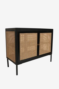 the sideboard is made out of wicker and black wood