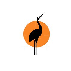 an orange and black bird standing in front of the sun with it's long legs