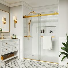 a bathroom with a sink, shower and toilet in it next to a large mirror