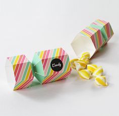 an origami box with candy in it