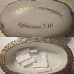 two white porcelain dishes with gold trim and words on the sides, one is empty