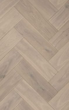 an image of wood flooring that looks like herringbones