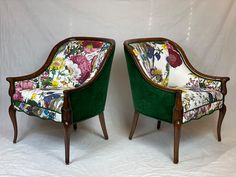 two green velvet chairs with floral upholstered back and arms, side by side