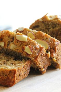 sliced loaf of banana nut bread sitting on top of a cutting board