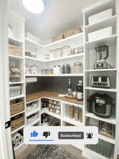 an organized pantry with white shelving and lots of storage