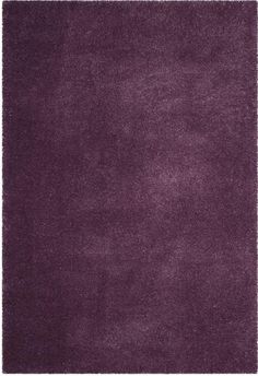 a purple rug with fringes on it