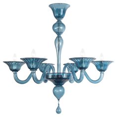 a blue chandelier with six lights hanging from it's center and four arms