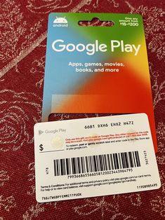 a google play card sitting on top of a red tablecloth with a barcode