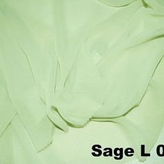 the fabric is light green in color and has a white background with black text that reads sage cloth