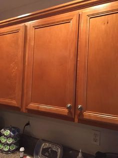 a kitchen with wooden cabinets and appliances on the counter