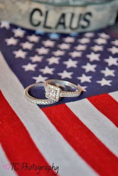 a close up of a ring on top of an american flag