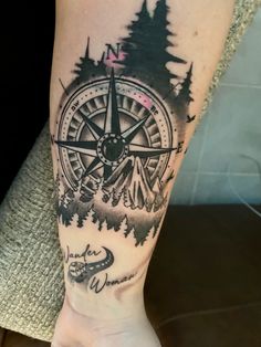 a person with a compass tattoo on their arm