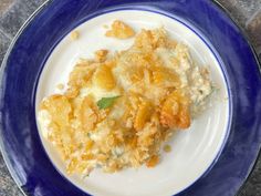 a blue and white plate with some food on it